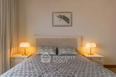 Cozy bedroom with elegant decor and soft lighting, perfect for relaxation.