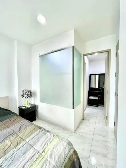 Modern bedroom with ensuite bathroom and stylish decor