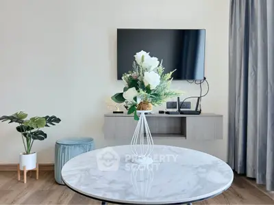 Modern living room with stylish decor and wall-mounted TV