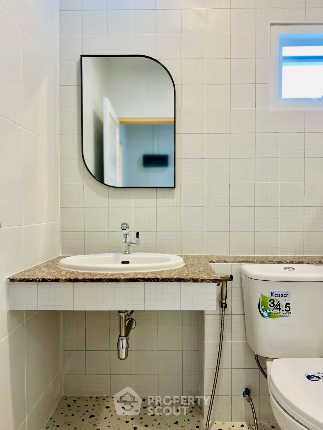 Modern bathroom with stylish mirror and elegant fixtures