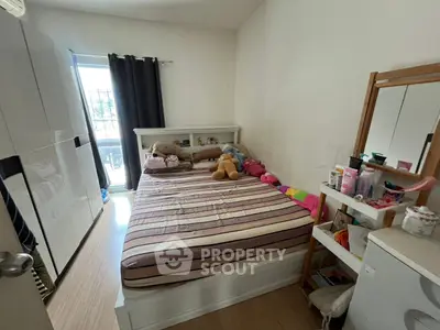 Cozy bedroom with ample storage and natural light, perfect for a restful retreat.