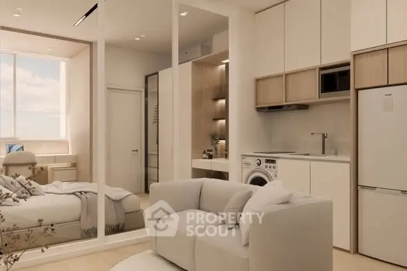 Modern studio apartment with cozy living area and integrated kitchen appliances.