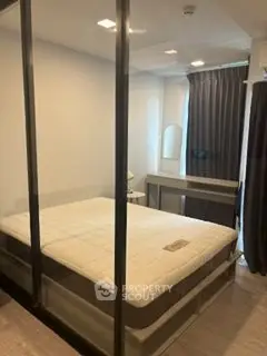 Modern bedroom with glass partition and stylish decor