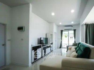 Spacious modern living room with sleek furniture and natural light