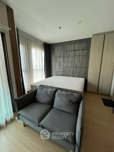 Modern bedroom with stylish decor and natural light