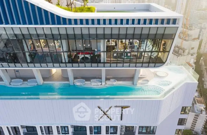 Luxurious rooftop pool with stunning city views at modern high-rise building.