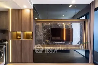 Modern living room with sleek wooden cabinetry and mounted TV, featuring elegant marble accents.