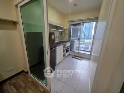Modern kitchen with balcony view in high-rise apartment