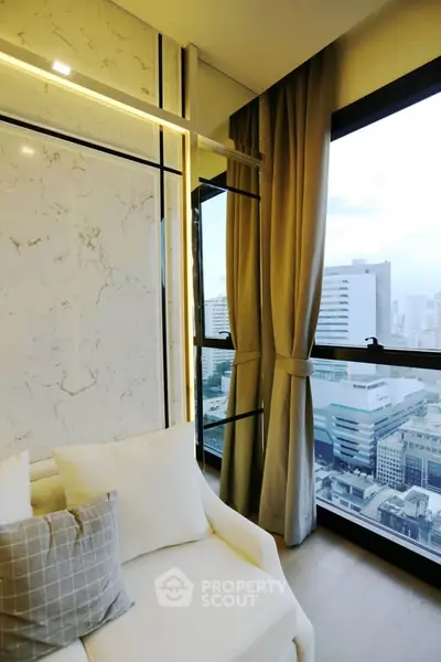 Luxurious high-rise apartment with stunning city view and elegant interior design.