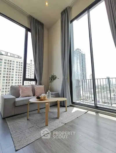 Modern living room with floor-to-ceiling windows and city view
