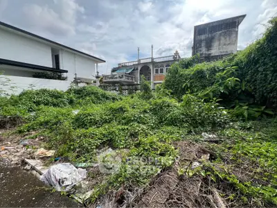 Vacant land with lush greenery ideal for development in urban setting