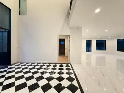 Spacious modern interior with high ceilings and elegant flooring