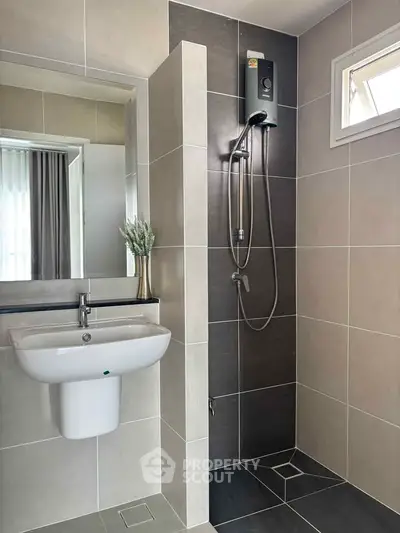 Modern bathroom with sleek shower and elegant sink design