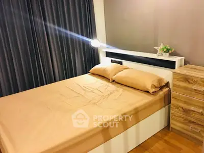Cozy bedroom with modern furnishings and warm lighting, perfect for relaxation.