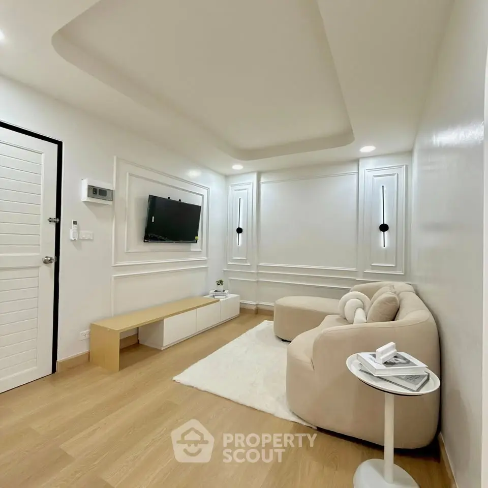 Modern living room with elegant decor and cozy seating area