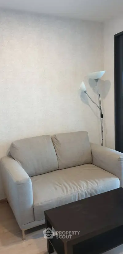 Cozy living room with modern sofa and stylish floor lamp