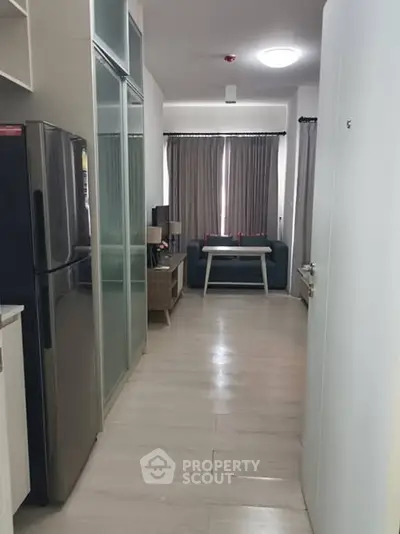 Modern apartment interior with sleek kitchen and cozy living area