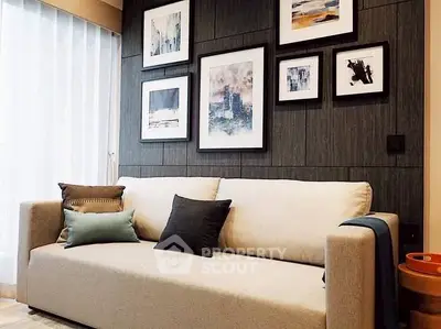 Stylish living room with modern art and cozy sofa in elegant apartment.