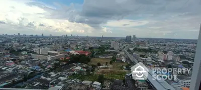 Stunning panoramic cityscape view from high-rise building, showcasing urban skyline and expansive horizon.