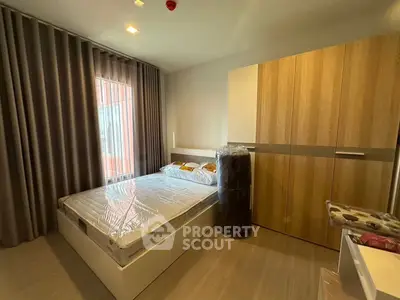 Modern bedroom with sleek design and ample storage space