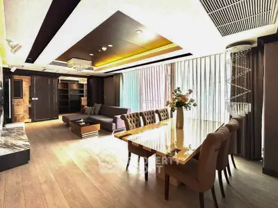 Luxurious open-plan living and dining area with elegant decor and ample natural light.