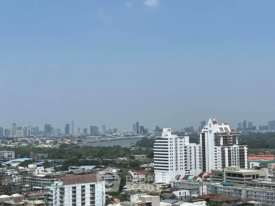 Stunning cityscape view showcasing high-rise buildings and river, perfect for urban living enthusiasts.