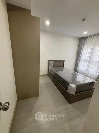 Modern bedroom with sleek design and natural light