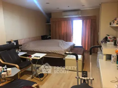 Cozy bedroom with large bed and exercise equipment, perfect for relaxation and fitness.