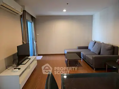 Spacious living room with modern furniture and natural light