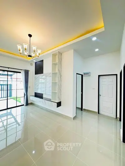 Spacious modern living room with elegant lighting and large windows