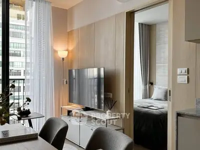 Modern apartment interior with stylish living room and cozy bedroom view.