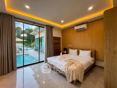 Luxurious bedroom with pool view, modern design, and ambient lighting in a serene setting.