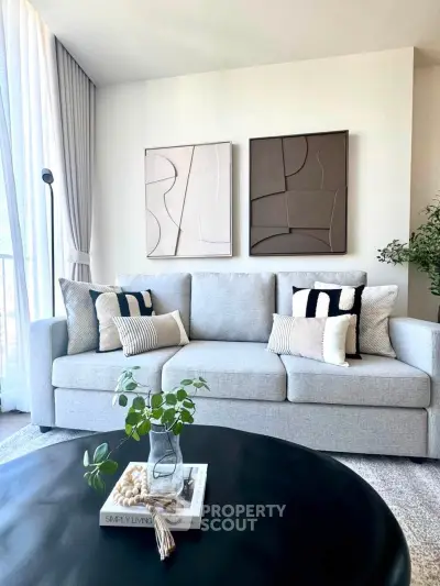 Stylish modern living room with elegant decor and cozy sofa, perfect for relaxation and entertaining.