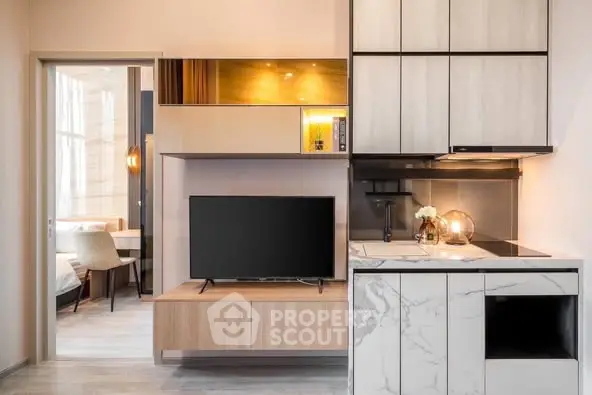 Modern open-plan living room with sleek kitchen design and stylish decor