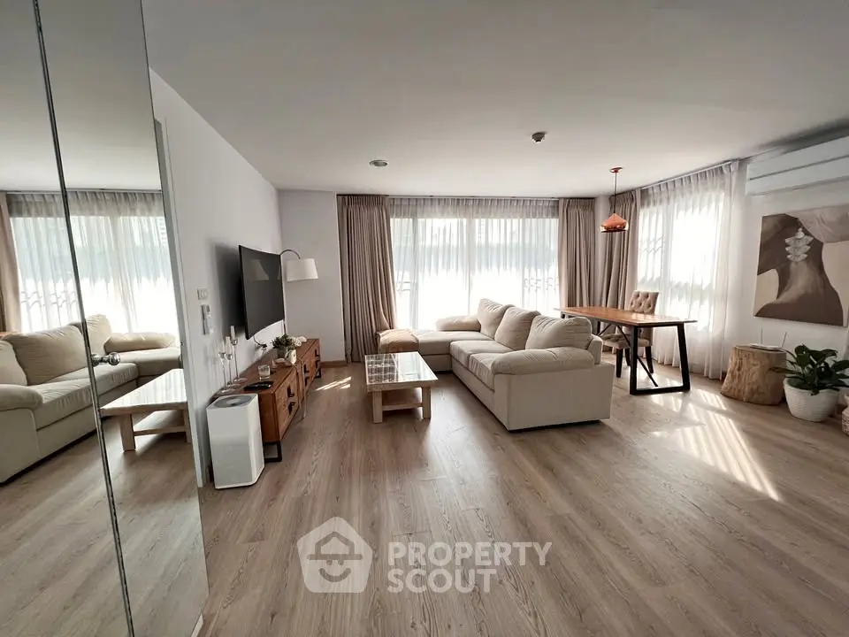 Spacious modern living room with natural light and stylish decor