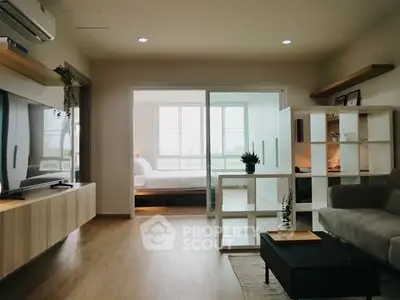 Modern open-plan living room with stylish decor and natural light