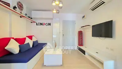 Stylish living room with modern decor and vibrant accents in a cozy apartment.