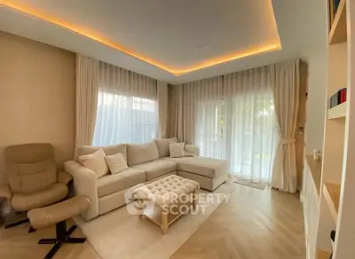 Elegant living room with cozy seating and natural light