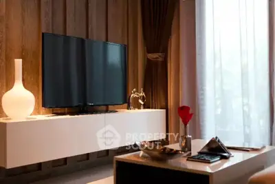 Modern living room with stylish decor and large TV