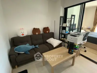 Cozy living room with plush sofa and modern decor, perfect for relaxation and comfort.
