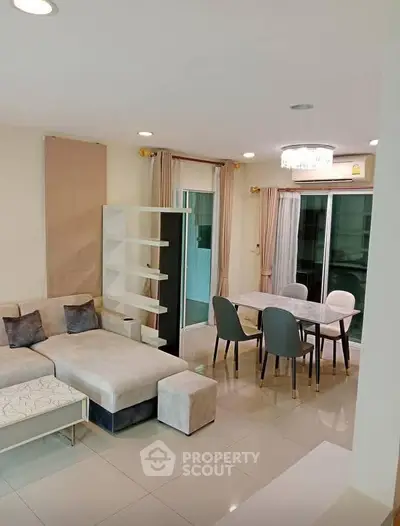 Modern living room with stylish furniture and dining area in open layout