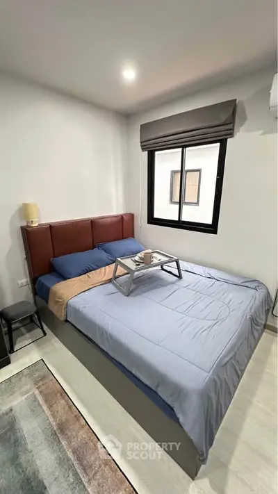 Cozy bedroom with modern decor and natural light