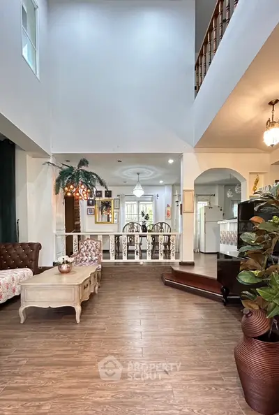 Spacious living room with elegant decor and open layout, perfect for family gatherings.