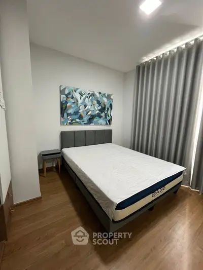 Modern bedroom with stylish decor and natural light