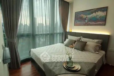 Luxurious bedroom with floor-to-ceiling windows and elegant decor in a modern apartment.