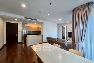 Spacious open-plan living room with modern kitchen and cozy seating area