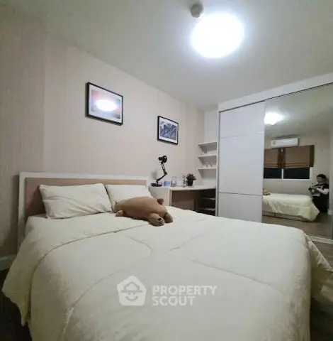 Cozy bedroom with modern decor and ample storage space