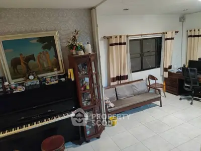 Charming living room with piano and stylish decor, perfect for cozy family gatherings.