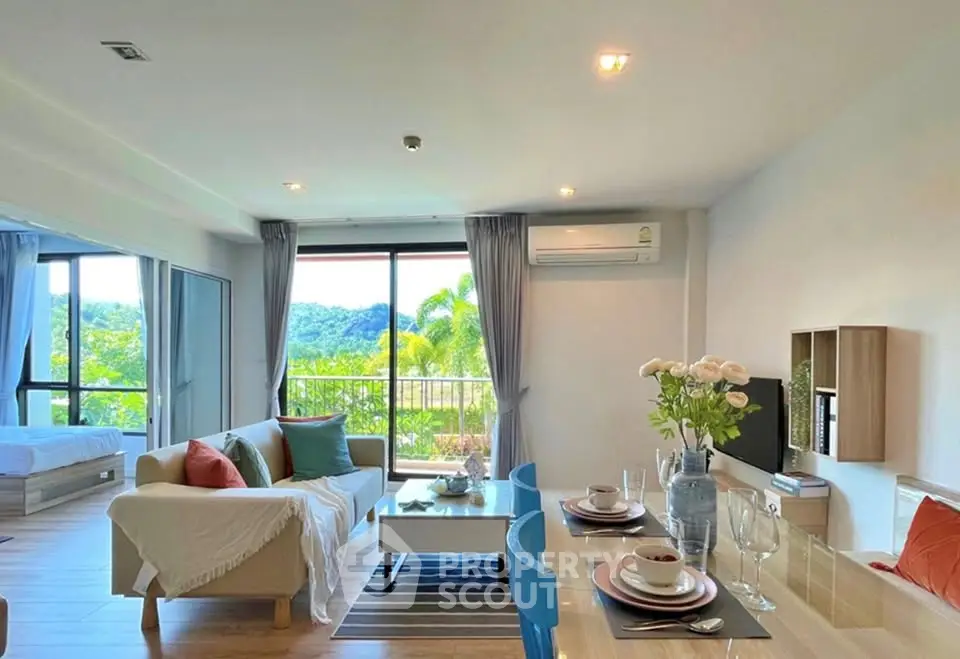 Spacious open-plan living room with dining area and scenic view