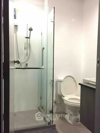 Modern bathroom with glass shower and sleek fixtures